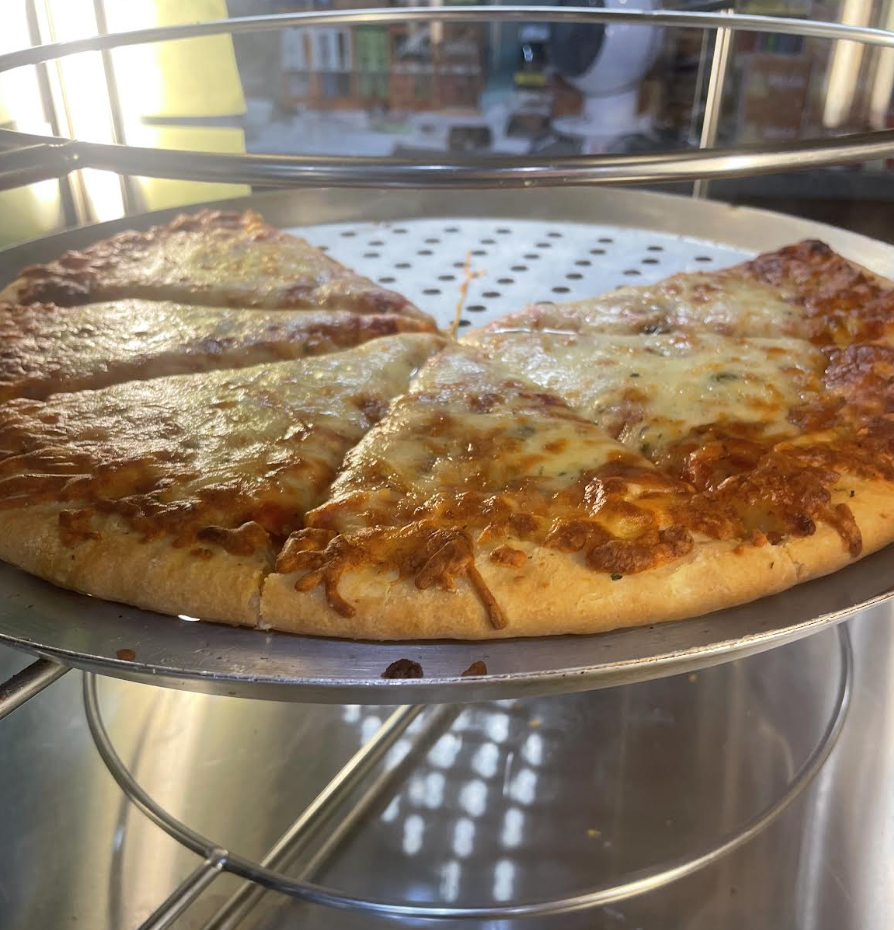 Fresh cheese pizza slices ready to serve